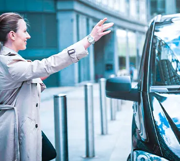  A helpful taxi cab driver, providing passengers with assistance with directions.